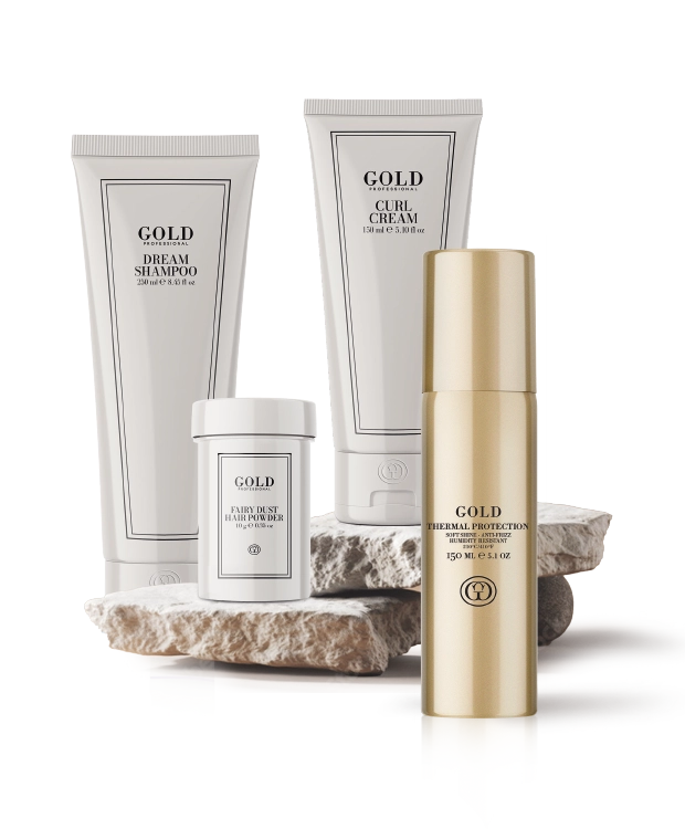 Premium Haircare Produkte von GOLD Professional auf Naturstein inszeniert.