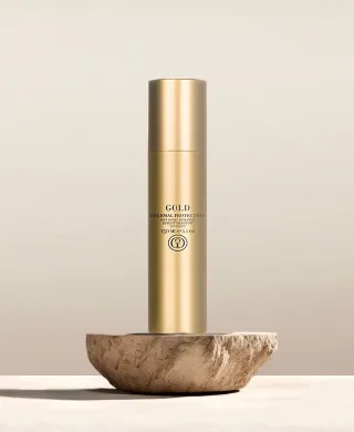 Styling- und Hitzeschutzprodukt von GOLD Professional im minimalistischen Design.